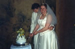 24. Charlotte and Tom cutting the cake