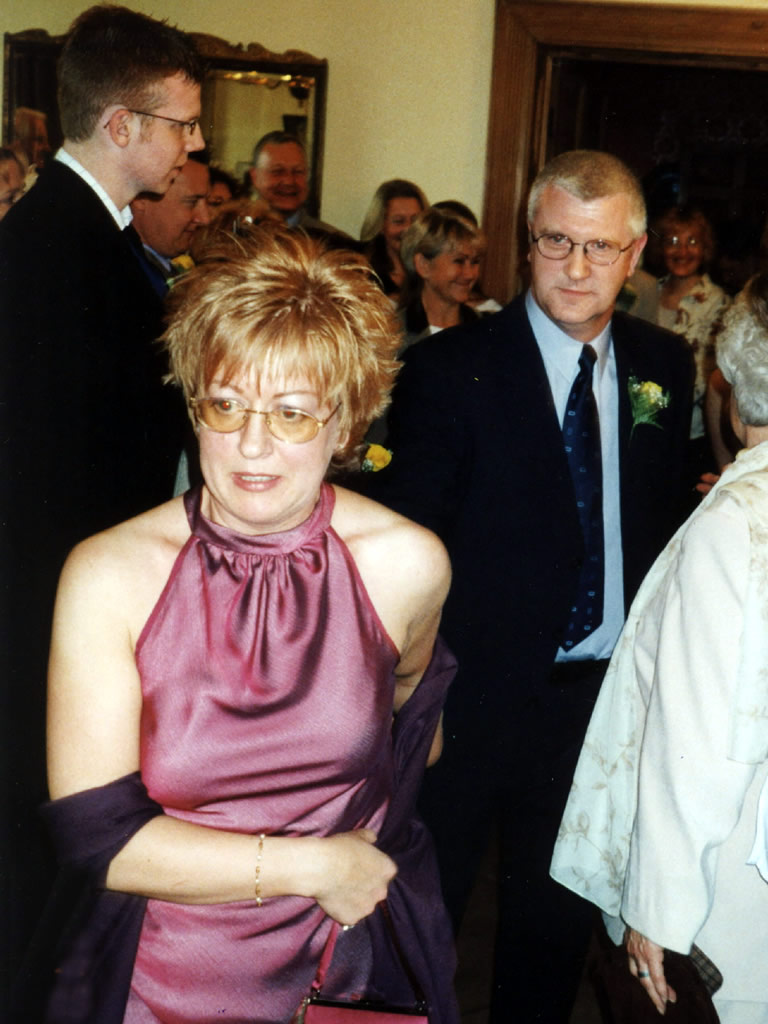 Sarah Ash leading Kingsley Ash through a crowd