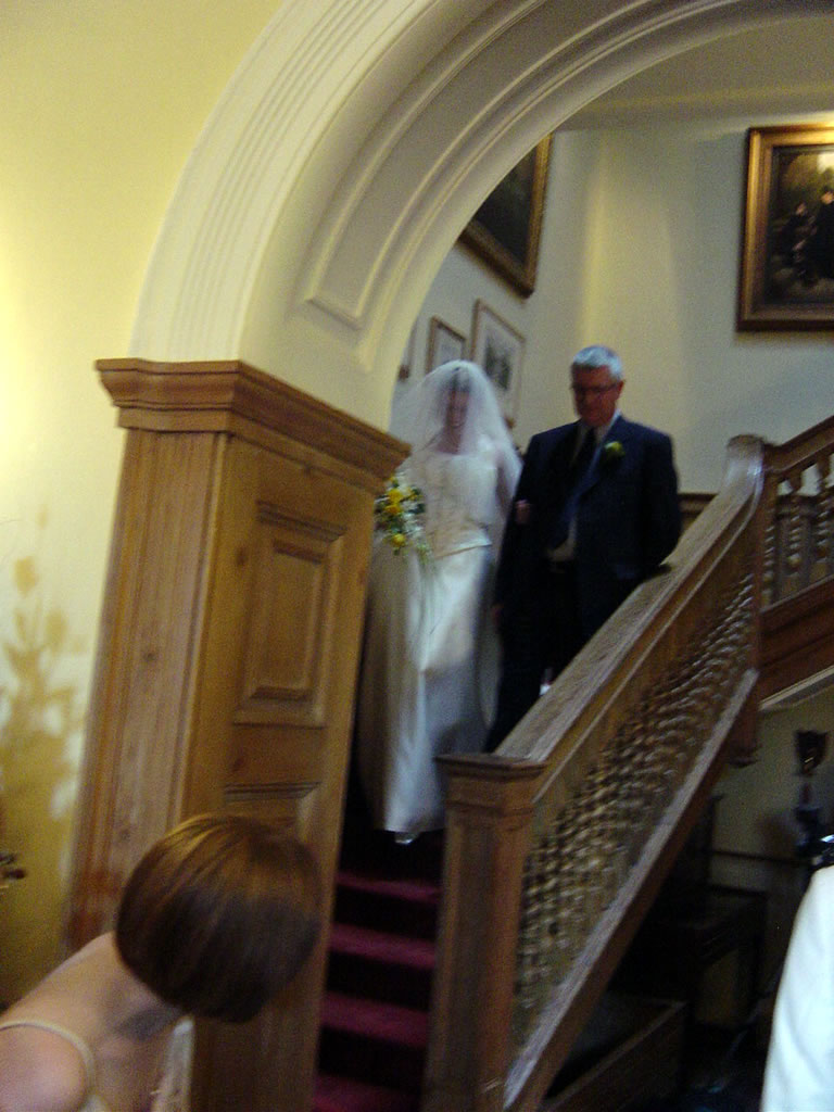 Charlotte & Kingsley Ash decending the staircase