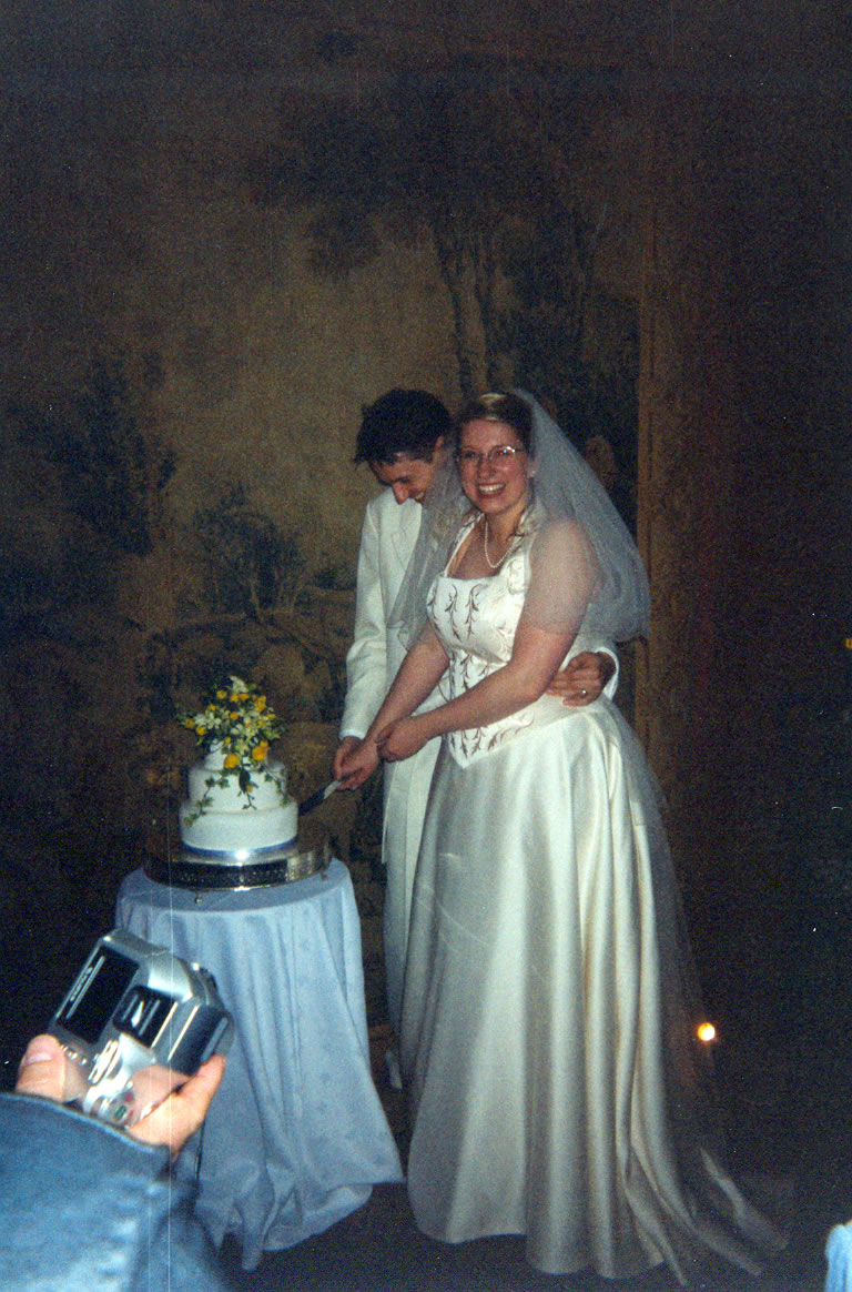 Tom & Charlotte cutting cake