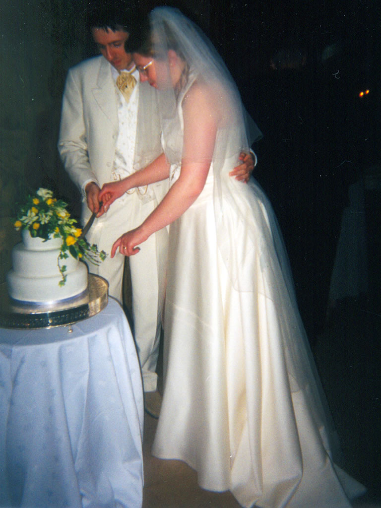 Tom & Charlotte cut cake
