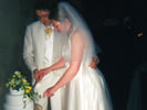 26. Tom & Charlotte cut cake